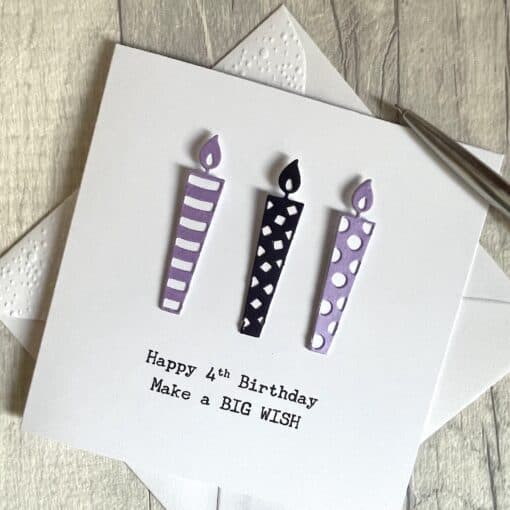 4th birthday card with candles in purple above scaled